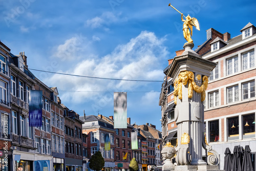 Golden statue of an angel on a memorial in the old town of Namur, Wallonia, Belgium