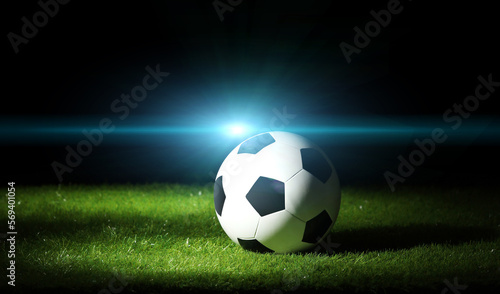 Soccer ball on the grass. Sport background.