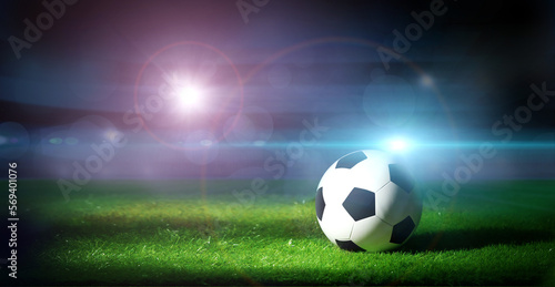 Soccer ball on the grass. Sport background.