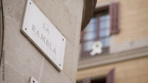 La Rambla signboard on building wall, sharp focus reveal shot photo