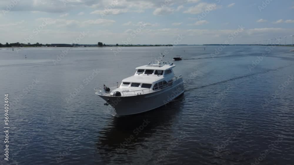 Luxurious white yacht sailing on water Luxurious white yacht sailing on water