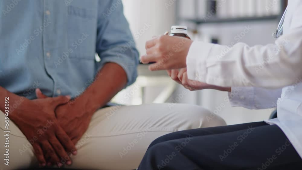 Close up of doctor's hands is explaining and advising about using pills medicine and treatment to the patient with sexual and reproductive health issues. Close up of doctor's hands is explaining and advising about using pills medicine and treatment to the patient with sexual and reproductive health issues.