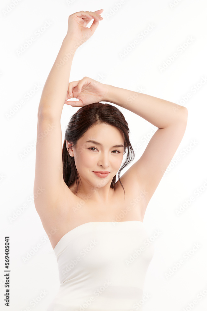 Beautiful Young Asian woman lifting hands up to show off clean and hygienic armpits or underarms on white background, Smooth armpit cleanliness and protection concept Beautiful Young Asian woman lifting hands up to show off clean and hygienic armpits or underarms on white background, Smooth armpit cleanliness and protection concept