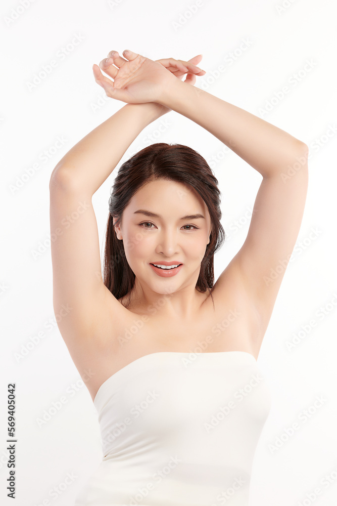 Beautiful Young Asian woman lifting hands up to show off clean and hygienic armpits or underarms on white background, Smooth armpit cleanliness and protection concept Beautiful Young Asian woman lifting hands up to show off clean and hygienic armpits or underarms on white background, Smooth armpit cleanliness and protection concept