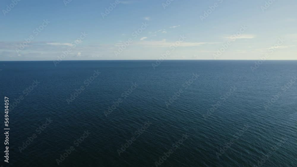 Daytime flight over the sea on a sunny morning. Dundalk, Ireland. Daytime flight over the sea on a sunny morning. Dundalk, Ireland.