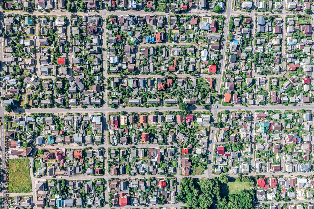 aerial top view of houses in a suburb residential area at sunny summer day