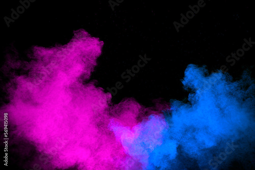 Blue pink color powder explosion on black background.