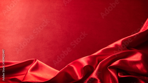 Fotografija ドレープのあるシルクの赤い布地の背景テクスチャー