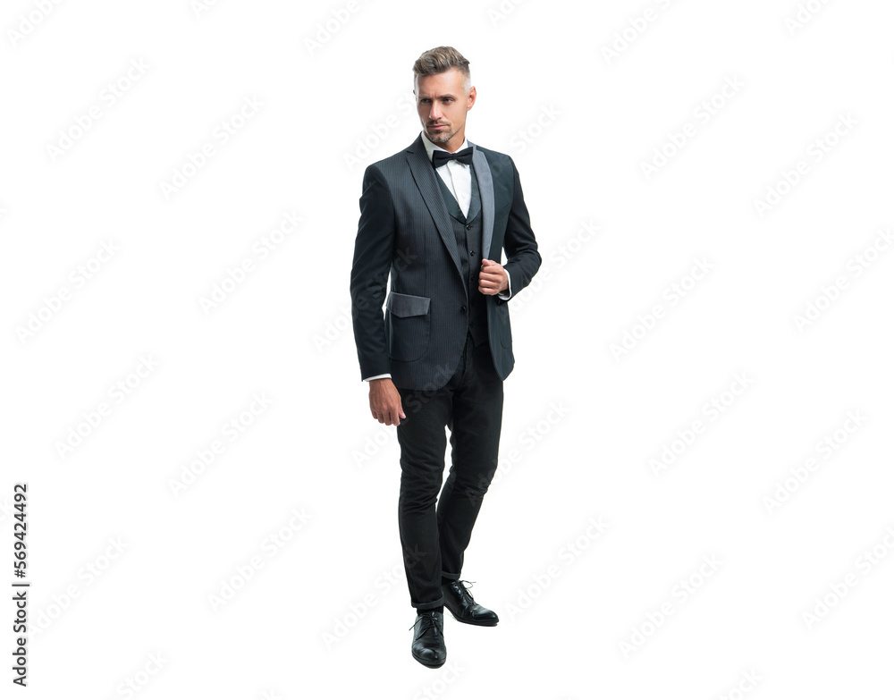 grizzled formal man in tuxedo bowtie isolated on white background. full length grizzled formal man in tuxedo bowtie isolated on white background. full length