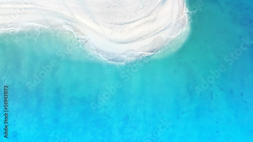 Aerial view with the lagoon with the tropical Summer with wave water as white sand beach background
