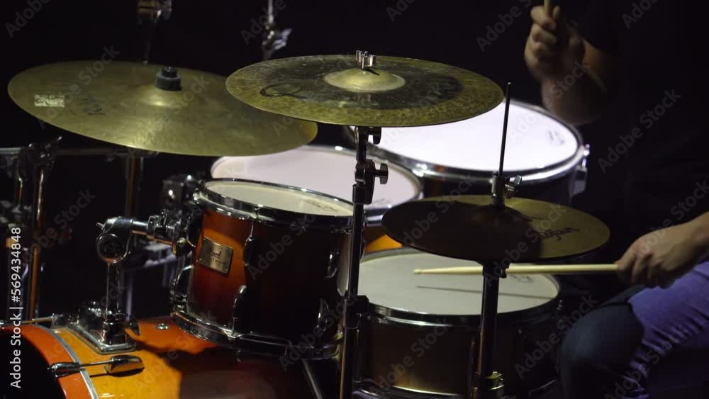 Close-up of a Live Band Playing a Concert as the Drummer Hits the Cymbal on His Drum Close-up of a Live Band Playing a Concert as the Drummer Hits the Cymbal on His Drum