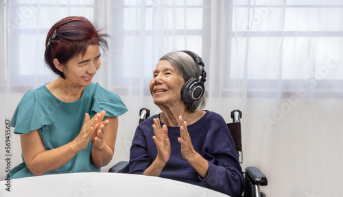 Music therapy in dementia treatment on elderly woman. photo