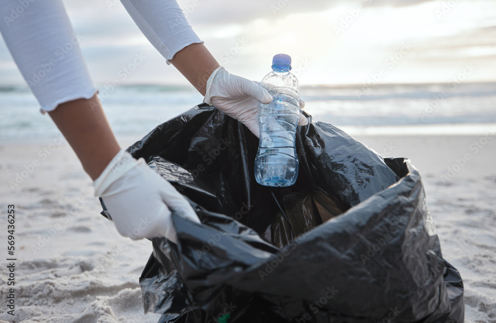 Cleaning, plastic and hands of woman at beach for recycle, environment