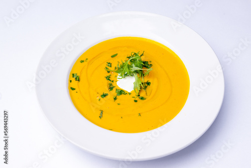 Pumpkin soup with cream and herbs