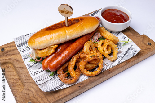HOT DOG with red cabbage, fried onion rings, BBQ sauce