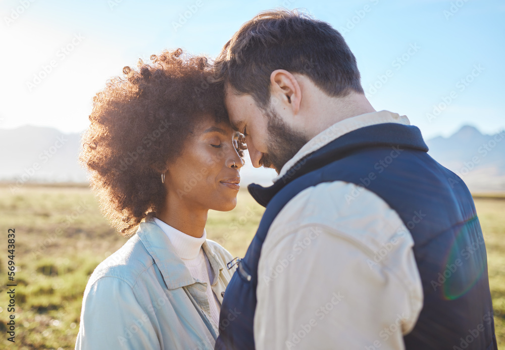 Intimacy, love and couple in nature on a farm for a romantic anniversary or valentines day date. Intimate, affection and interracial man and woman in a romance moment together on a eco friendly field Intimacy, love and couple in nature on a farm for a romantic anniversary or valentines day date. Intimate, affection and interracial man and woman in a romance moment together on a eco friendly field