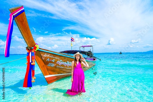 woman with a pink dress on the beach in krabi thailand, chicken island, tup island, photo shooting, model shooting