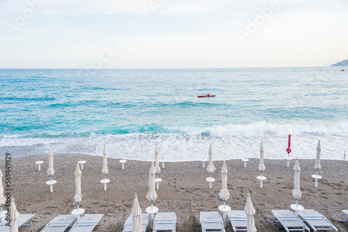 Beach Chairs and Umbrellas on The Maiori Beach, Amalfi Coast, Campania, Italy photo