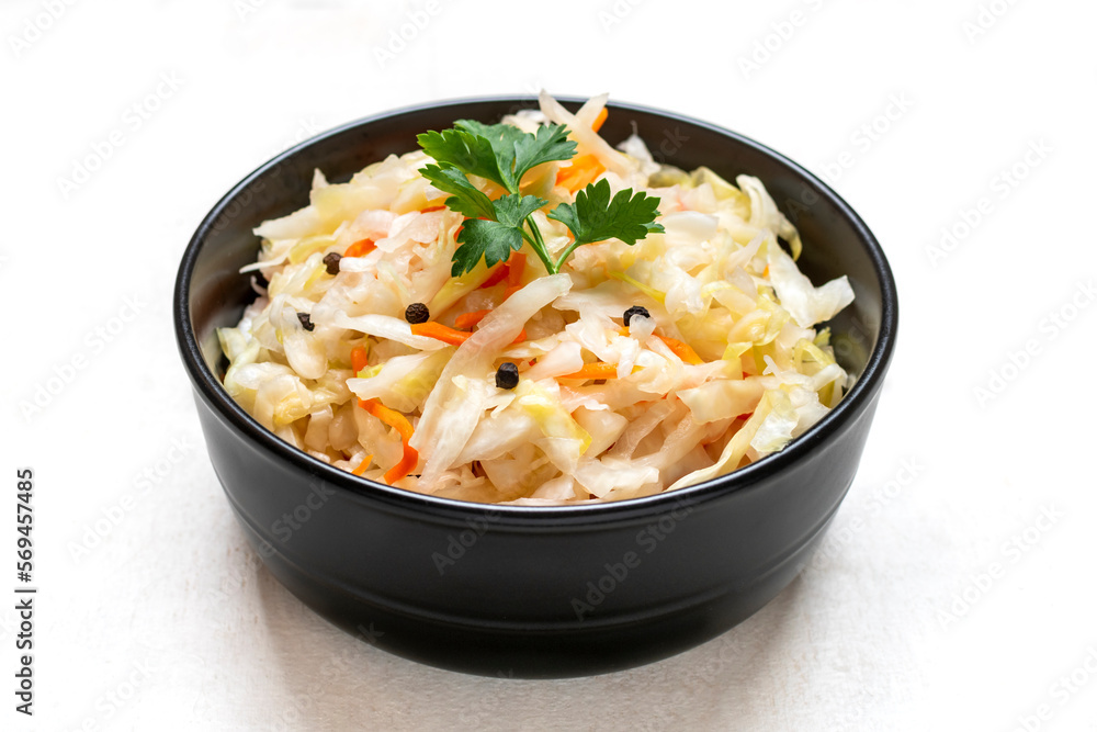 sour cabbage in wooden bowl pepper on white table Fermented vegetable concept Healthy food Top view sour cabbage in wooden bowl pepper on white table Fermented vegetable concept Healthy food Top view