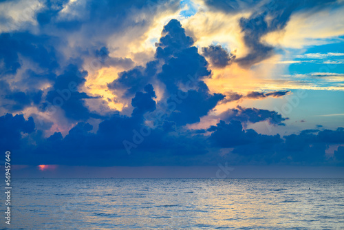 Sea beach with sky sunset or sunrise. Clouds over the sunset sea. Sunset at tropical beach. Nature sunset landscape of summer morning sea.