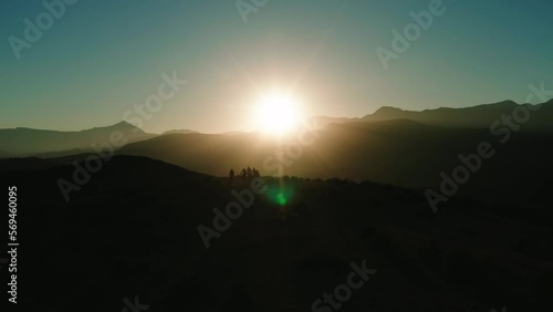 mountainbikes silhouette at sunrise in Atlas mountains photo