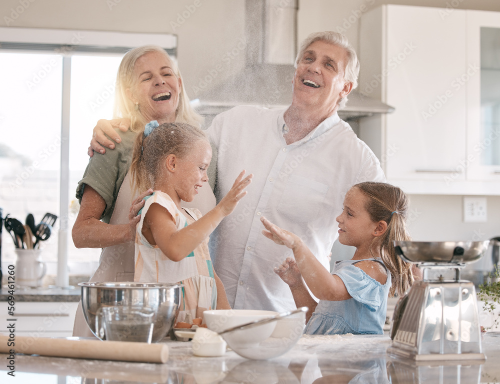 Obraz premium Funny family, baking and children helping grandparents in home kitchen with food. Woman, man and girl kids learning to make cookies, pancakes or cake for breakfast with love, care and fun teamwork