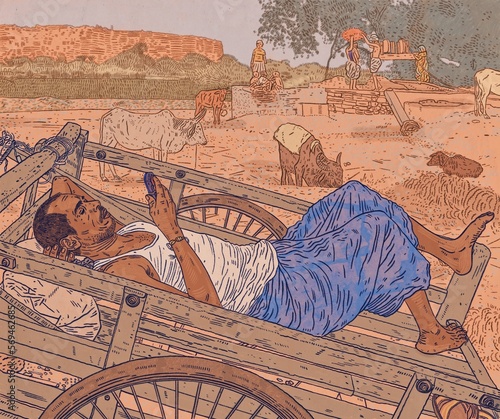Indian Man Reclining on Wooden Farming Cart Looking at Mobile Phone in Landscape with Cattle 