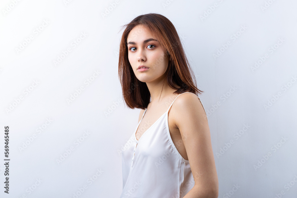 Beautiful smiling woman with clean skin, natural make-up and white teeth on a gray background Beautiful smiling woman with clean skin, natural make-up and white teeth on a gray background