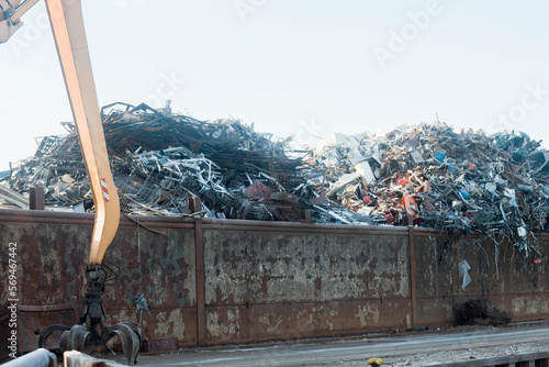 Heap of scarp metal for recycling at scrap yard photo