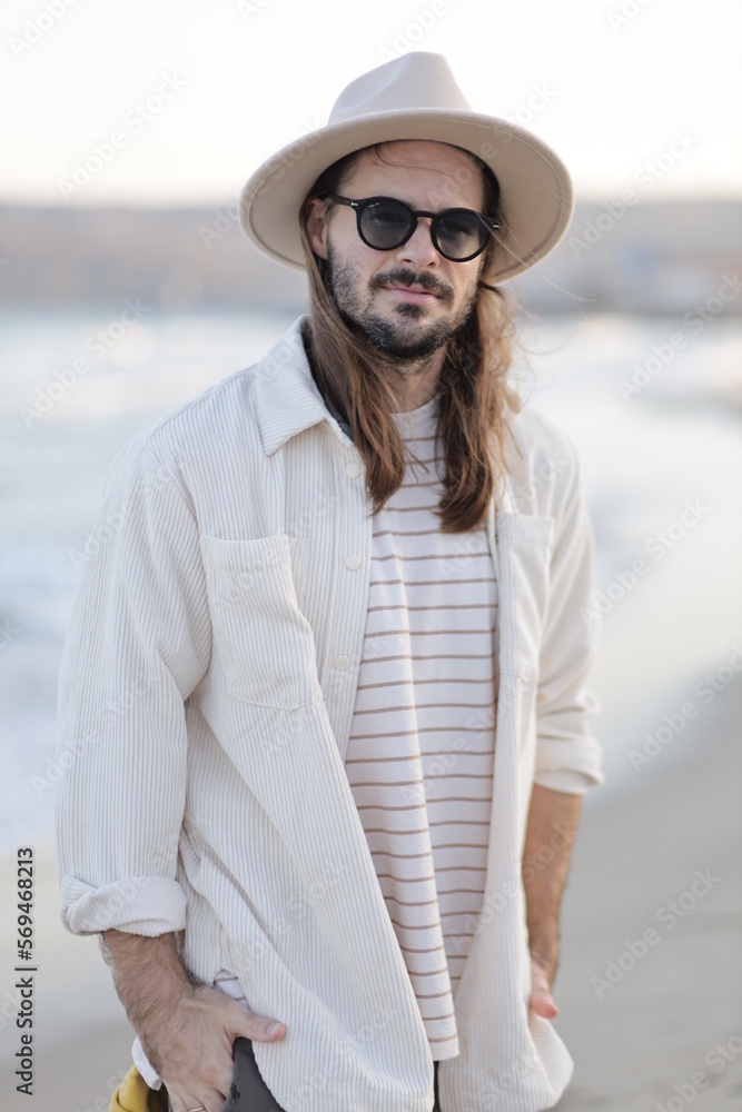 portrait of a man in a hat in varna bulgaria on the beach, model shooting , beach shooting 