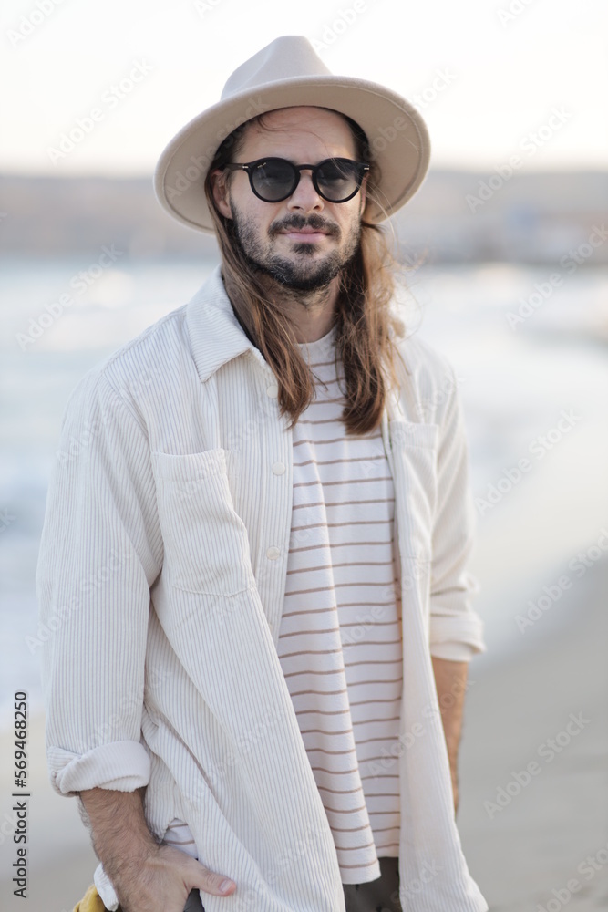 portrait of a man in a hat in varna bulgaria on the beach, model shooting , beach shooting 