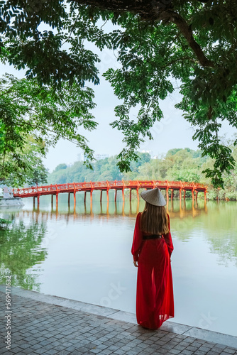 Asian travel to The Huc bridge entrance to Ngoc Son temple on Hoan Kiem lake, Hanoi, Vietnam photo