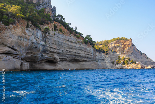 View of the rocky shore from the sea. Mediterranean Sea in Turkey. Popular tourist places. Background