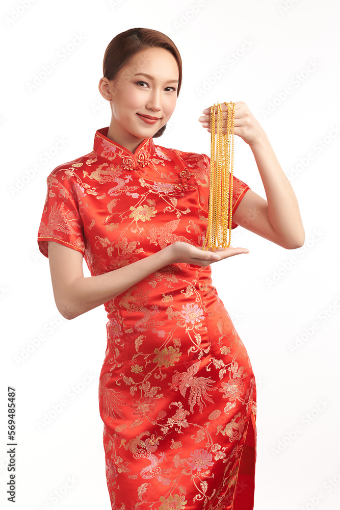 Chinese new year festival, Beautiful Young asian woman wearing traditional cheongsam qipao dress with gold necklaces on white background, Chinese new year festival, Beautiful Young asian woman wearing traditional cheongsam qipao dress with gold necklaces on white background,