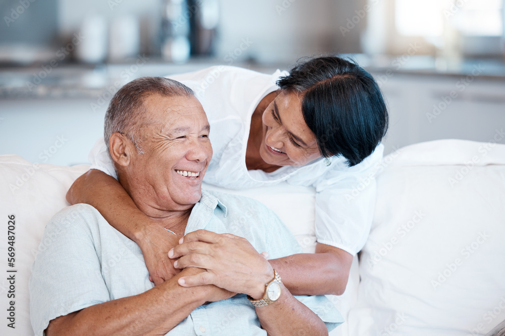 Obraz premium Love, retirement and smile with a senior couple in the living room of their home together to relax. Sofa, bonding or marriage with a mature man and woman relaxing in the lounge of their house