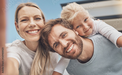 Selfie, happy and portrait of a family at their house after moving, relocation and buying a home. Real estate, mortgage and face of a mother, father and child with a photo outside of a new apartment