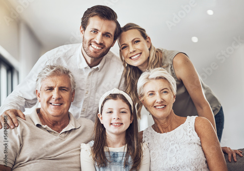 Smile, big family and portrait on sofa in home living room, bonding and enjoying quality time together. Love, care and happy grandparents, father and mother with girl, child or kid relaxing on couch.