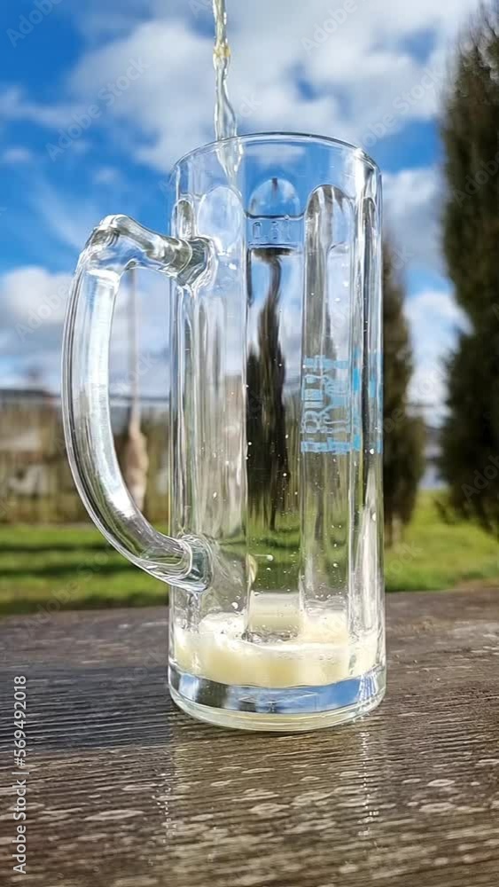 pour a glass of beer in slow motion, overflow pour a glass of beer in slow motion, overflow