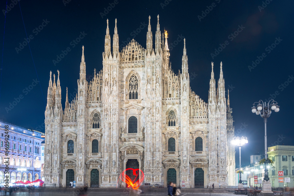 Person Light Painting a Heart Shape in Front of the Cathedral in City of Milan, Lombardy, Italy.