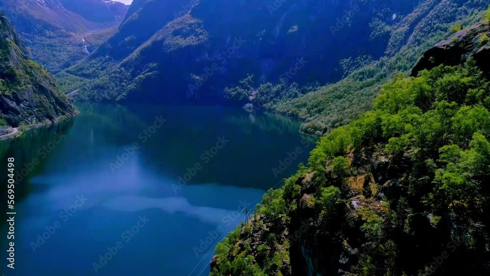 A beautiful lake with blue water in the middle of the mountains in Norway A beautiful lake with blue water in the middle of the mountains in Norway