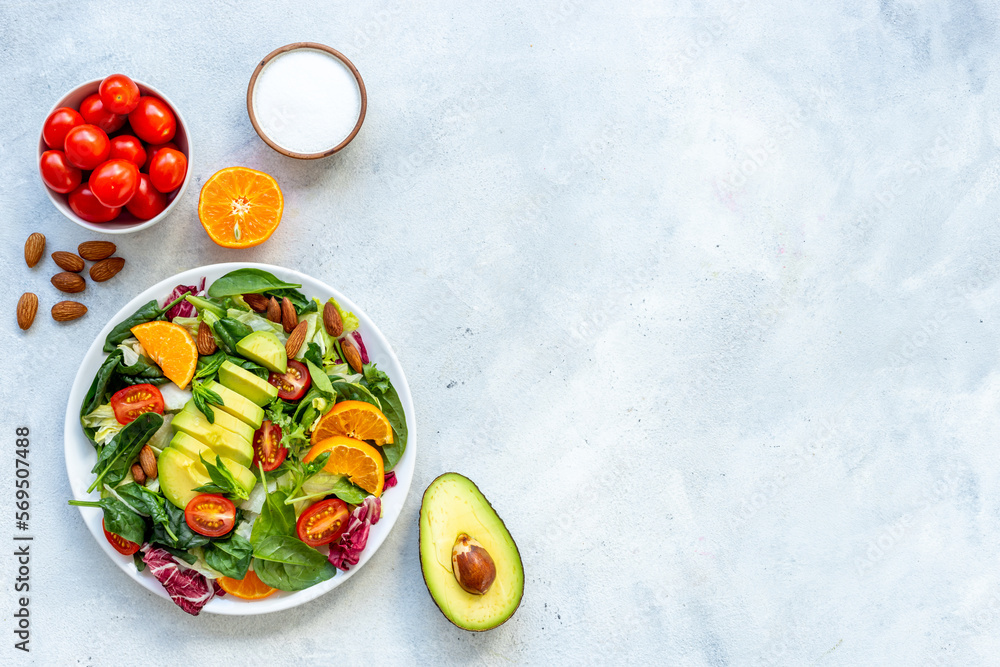 Bowl full of healthy vegetarian salad with avocado and tomatoes Bowl full of healthy vegetarian salad with avocado and tomatoes