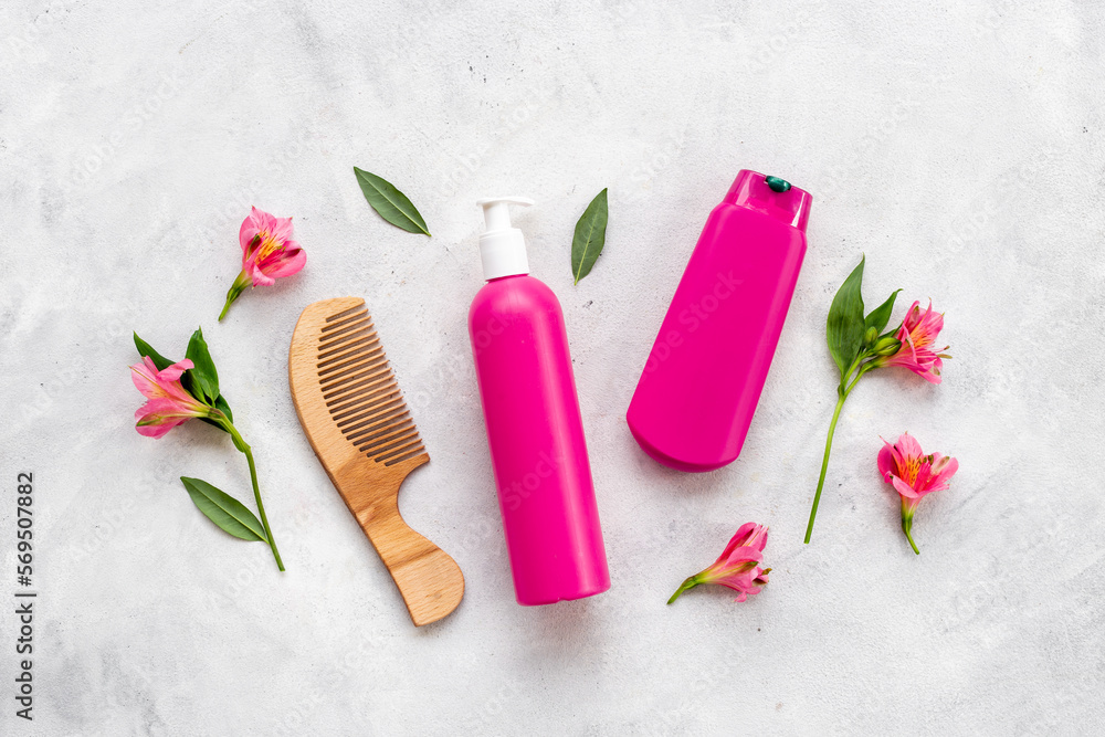 Set of hair care and styling products with flowers Set of hair care and styling products with flowers