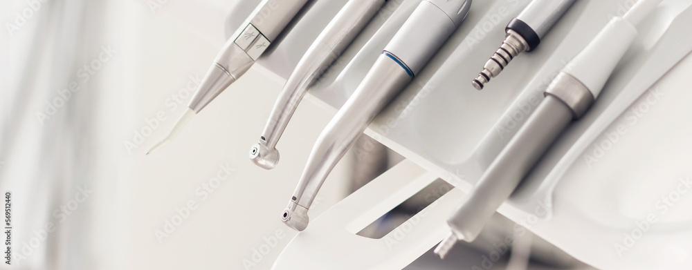 Closeup banner of a modern dentist tools, burnishers with blurred background. High quality horizontal photo from dentist room. Closeup banner of a modern dentist tools, burnishers with blurred background. High quality horizontal photo from dentist room.