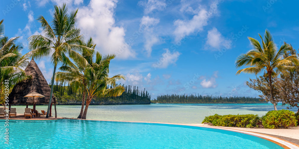 Infinity pool and palm trees, tropical beach, luxury travel resort in the Isle of Pines, New Caledonia