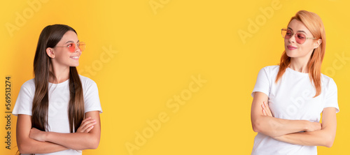 Mother and daughter child banner, copy space, isolated background. beauty and fashion. female fashion model. young girls in eyeglasses.