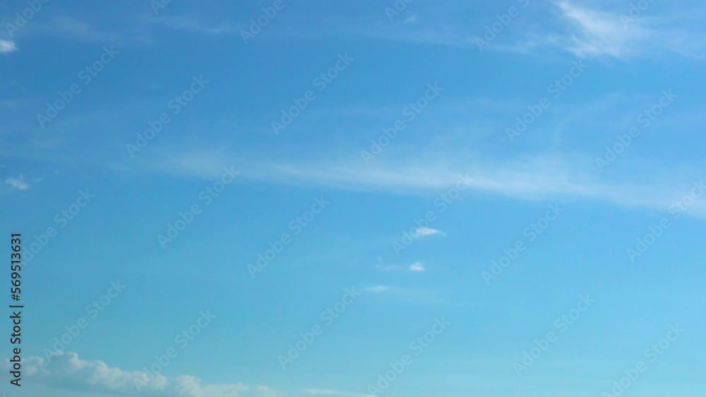 Slow Motion Time Lapse of Clear Pure Azure Sky and Cirrus White Clouds in Sunny Weather. White Clouds like Feathers Float across the Sky in a Clear Sunny Sky. Ozone, Atmosphere, Heaven, Beauty, Relax. Slow Motion Time Lapse of Clear Pure Azure Sky and Cirrus White Clouds in Sunny Weather. White Clouds like Feathers Float across the Sky in a Clear Sunny Sky. Ozone, Atmosphere, Heaven, Beauty, Relax.