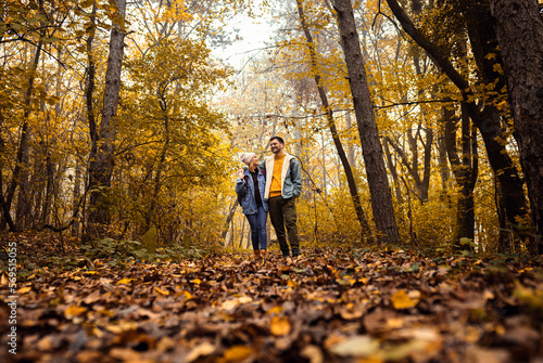 Couple spending time together walking in forest. © Zoran Zeremski