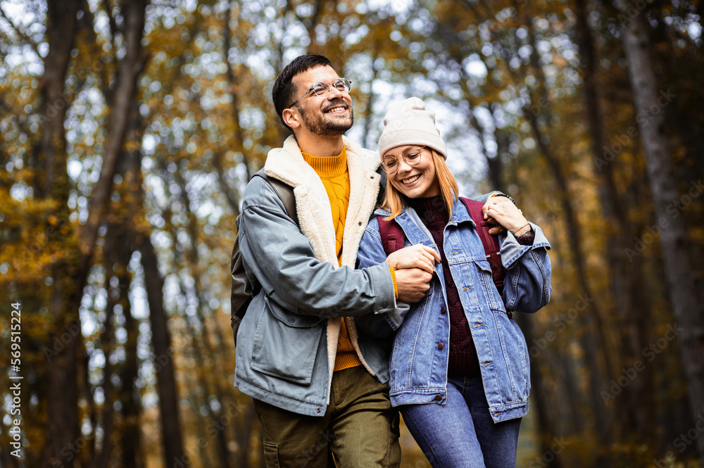 Fototapeta premium Couple spending time together walking in forest.