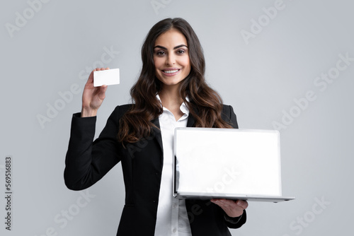 Online payment. Girl enter credit card info on webside to make purchase, using laptop to shop, paying bills with computer. Woman shopping online with credit card and laptop computer. photo