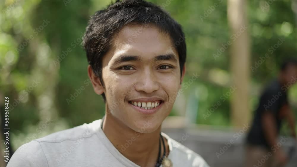 Portrait of young asian construction worker smiling to the camera Portrait of young asian construction worker smiling to the camera